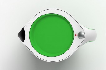 The bright green lid contrasts strongly with the iconic white of the kettle.